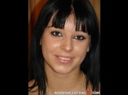 Petra is sited on a sofa, legs appart and looking at you