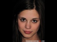 Little caprice is sited on a sofa, legs appart and looking at you