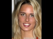 Chelsey lanette is sited on a sofa, legs appart and looking at you