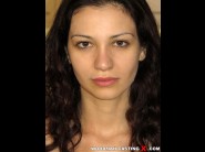 Jessica malone is sited on a sofa, legs appart and looking at you